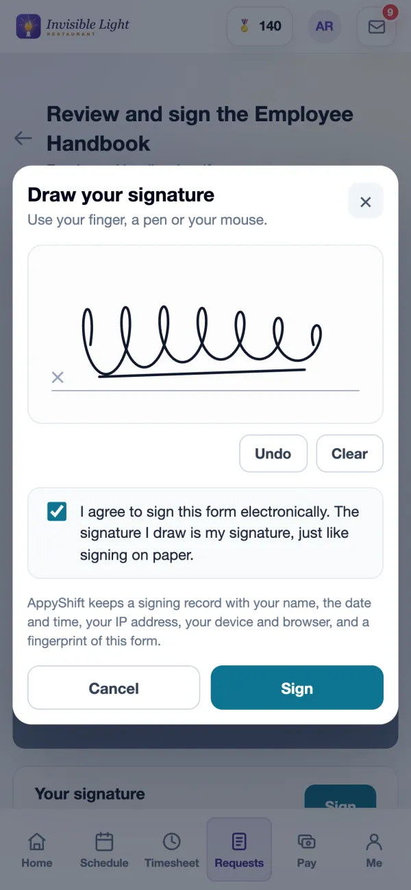 A new hire drawing their signature on a phone and agreeing to sign electronically